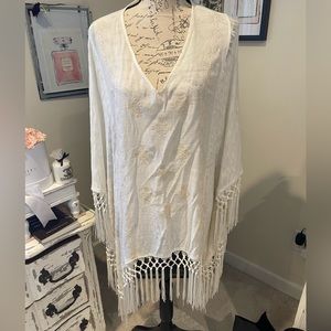 Beach coverup with fringe , arm holes with attached sides